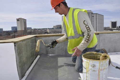 Beginning of the single-ply roof membrane installation process.